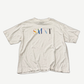 Saint Michael white tee front with multicolor rainbow SAINT logo text print across chest