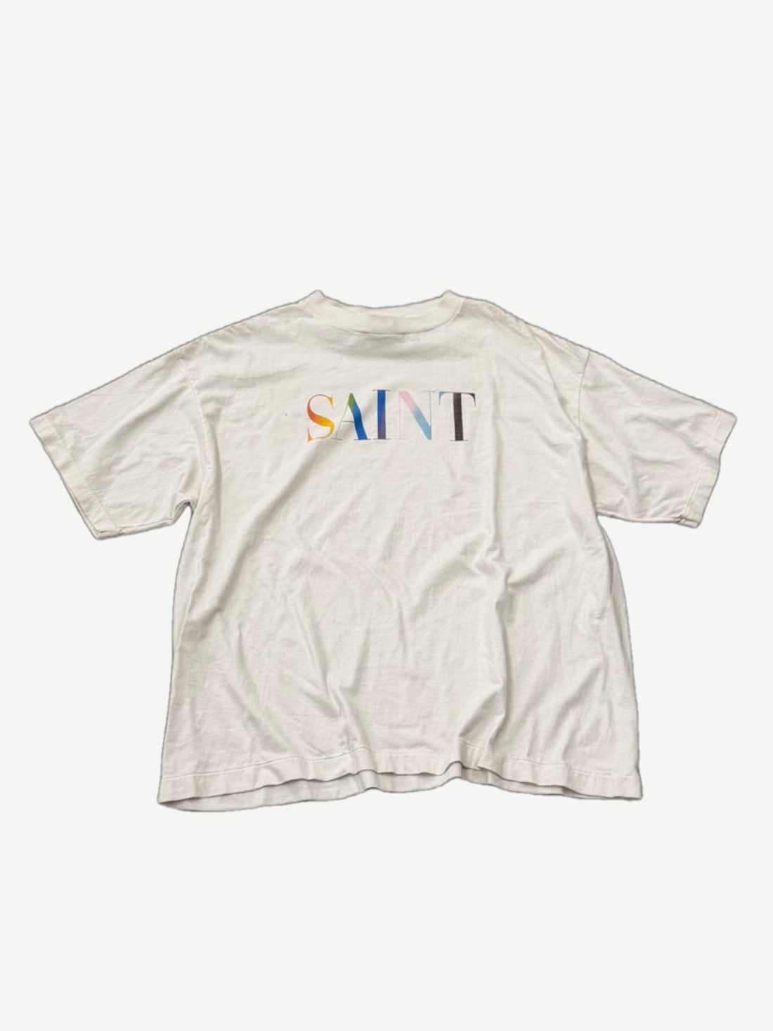 Saint Michael white tee front with multicolor rainbow SAINT logo text print across chest