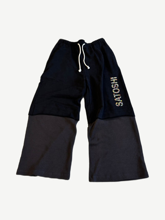 Satoshi Nakamoto black double-layer sweatpants with studded vertical logo and gray waffle thermal lower panels