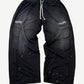 Satoshi Nakamoto black mesh moto sweatpants front with padded knee armor panels and white paint splatter