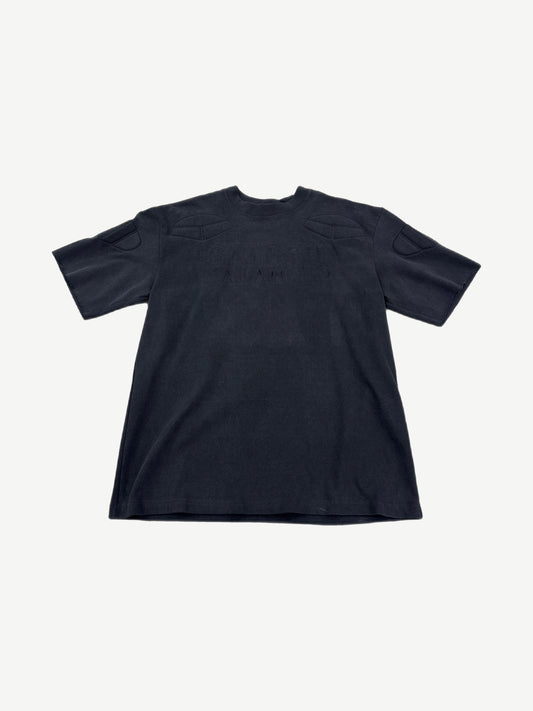 Satoshi Nakamoto black moto tee front with tonal embossed padded shoulder and chest panels.