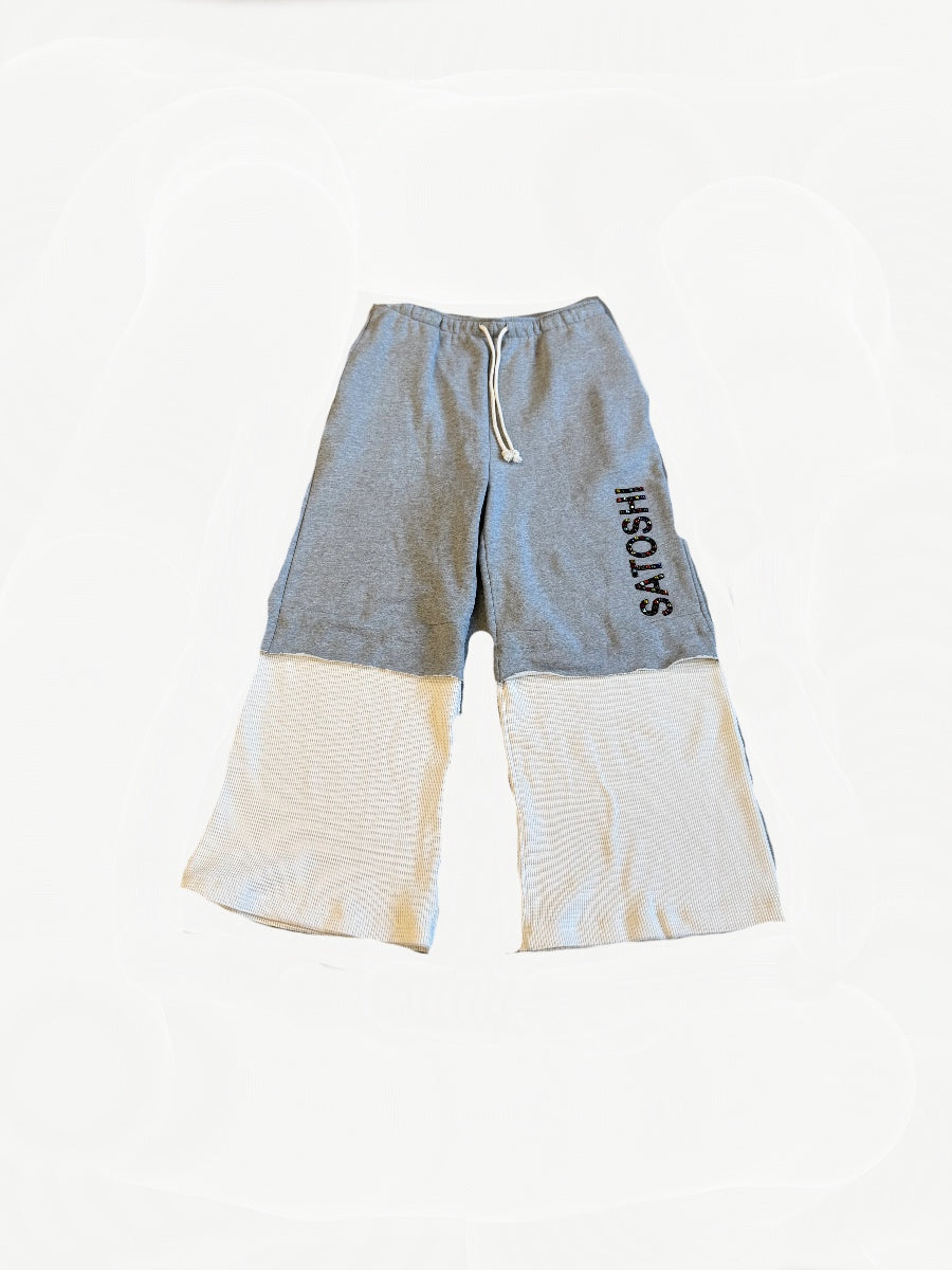 Satoshi Nakamoto gray sweatpants front with vertical Satoshi leg print, drawstring waist and cream waffle knit lower panel