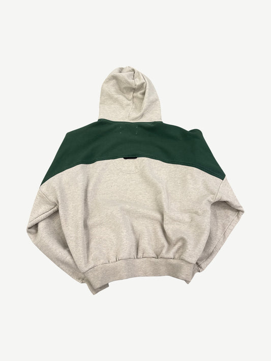 Satoshi Nakamoto green grey crossover hoodie back, contrasting paneled construction and embroidered logo detail.