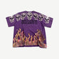 Satoshi Nakamoto purple tee front with row of rhinestone skulls and orange airbrushed flames hem.