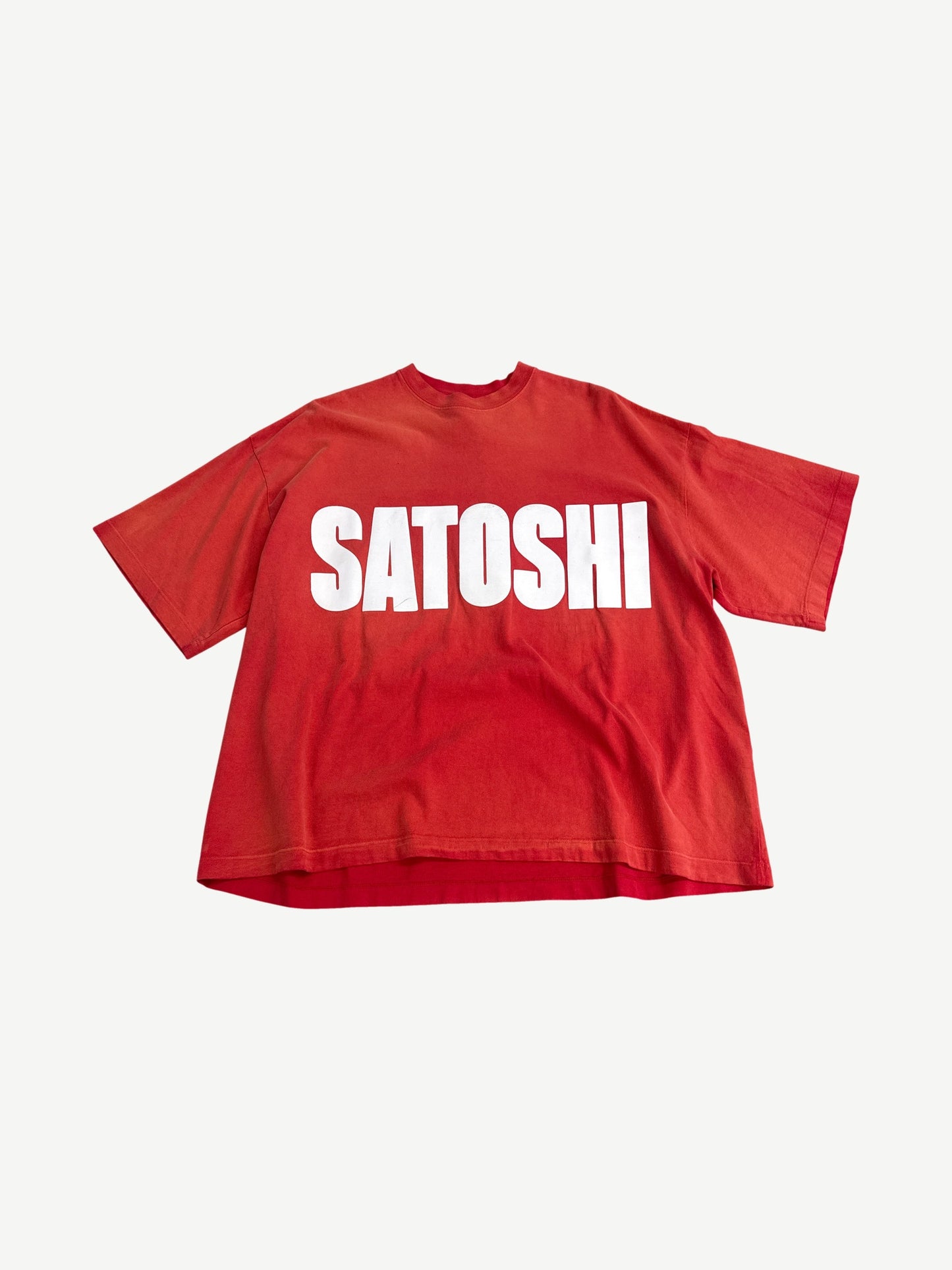 Satoshi Nakamoto oversized red tee with bold white Satoshi impact font logo printed across the chest