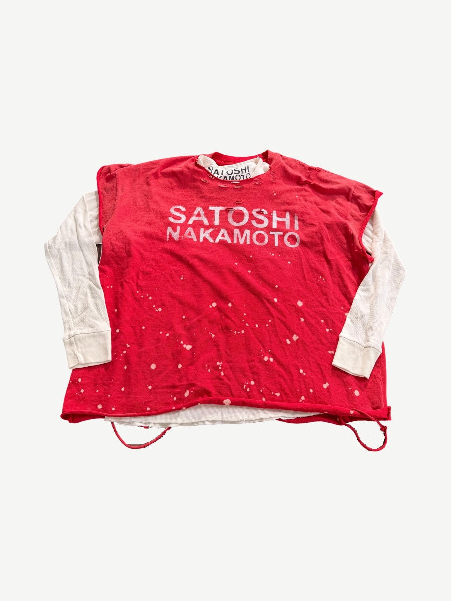 Satoshi Nakamoto red layered thermal longsleeve with bleach splatter print and white waffle knit sleeves.