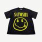 Satoshi Nakamoto faded black tee with yellow Nirvana-style smiley face and dollar sign eyes graphic