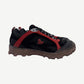 Sicko x 424 black hiking sneaker side profile with red overlay cage and mud-splattered brown chunky sole