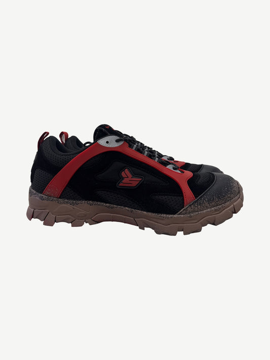 Sicko x 424 black hiking sneaker side profile with red overlay cage and mud-splattered brown chunky sole