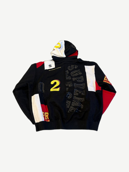Supreme Premier patchwork zip up back view with studded Supreme logos, yellow number 2 and contrast panels.