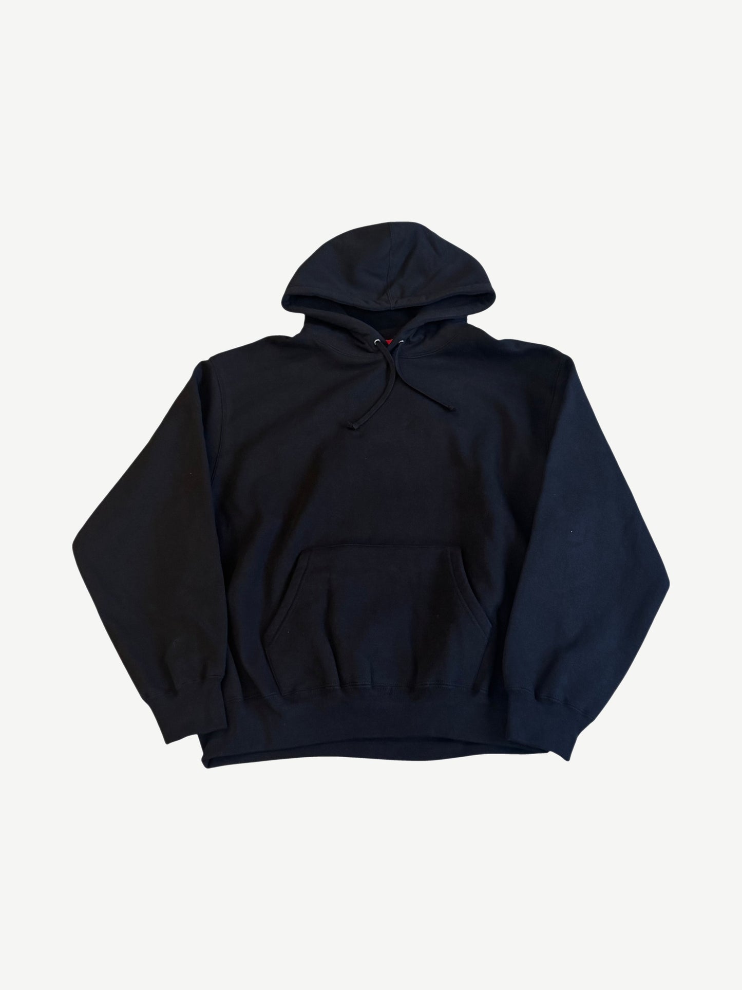 Supreme black satin applique hoodie front, plain black heavyweight cotton fleece with red kangaroo pouch tag.