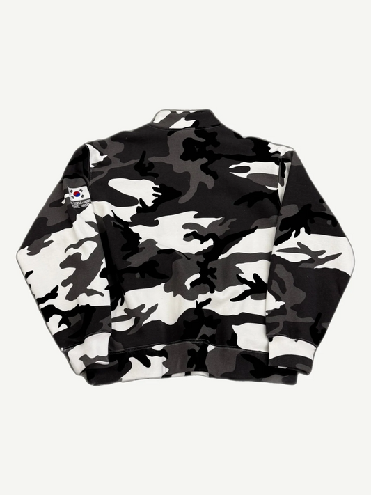Supreme snow camo half-zip pullover back view with black and white camo print and sleeve patch detail