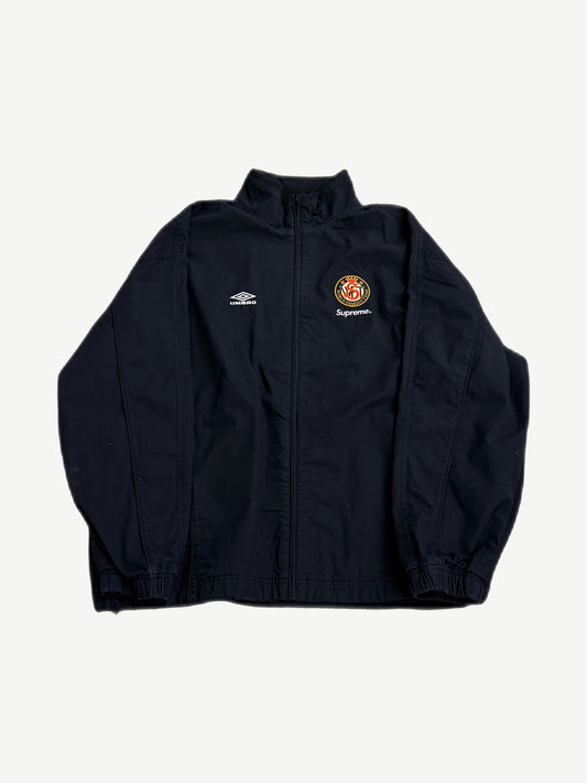 Supreme Umbro black cotton ripstop track jacket with chest zip pocket and embroidered logos, front view