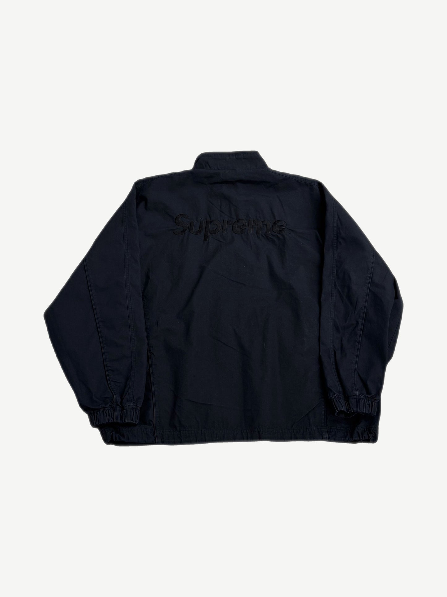 Supreme Umbro black track jacket back with tonal black Supreme box logo embroidery at upper shoulders