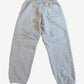 Back view of Supreme heather gray sweatpants with elastic waist, rear patch pocket and elasticated cuffs