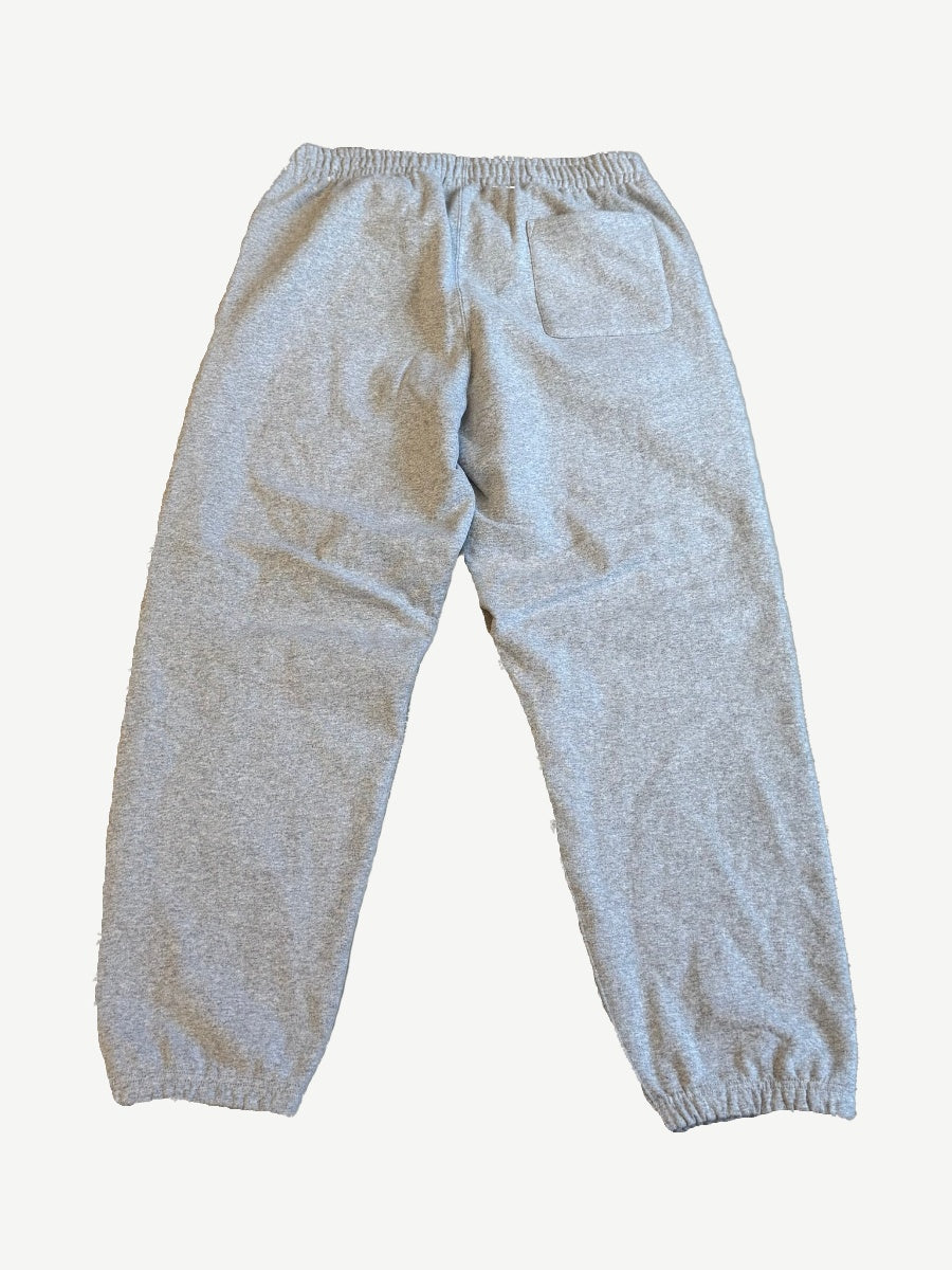 Back view of Supreme heather gray sweatpants with elastic waist, rear patch pocket and elasticated cuffs