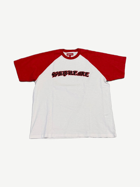 Supreme white raglan tee with red sleeves and gothic Supreme logo in rhinestone studded applique
