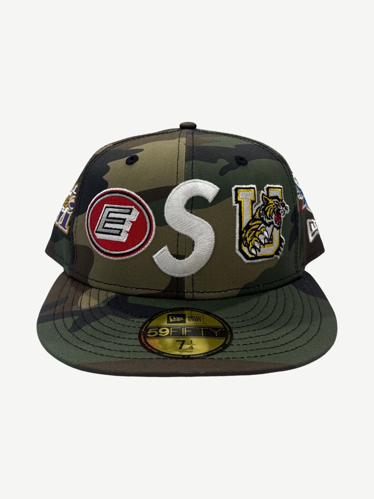 Supreme woodland camo New Era 59Fifty fitted cap with embroidered S logo and college mascot patches