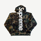 Supreme woodland camo hoodie back with vertical white satin applique Supreme logo from hood to hem