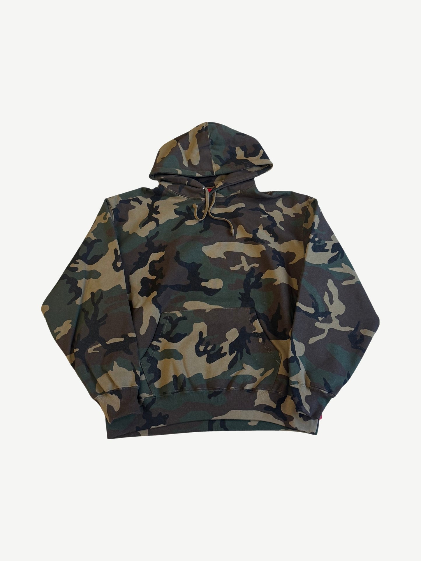 Supreme woodland camo pullover hoodie front view with brown green camo print and tonal drawstrings