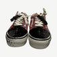 Front view of Vans Old Skool red tweed sneakers with mixed black checkered and white flat laces
