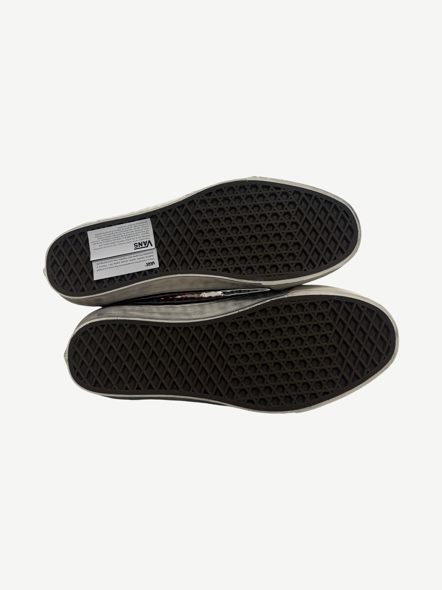 Sole view of Vans Premium Old Skool sneakers showing signature waffle tread pattern with Vans label