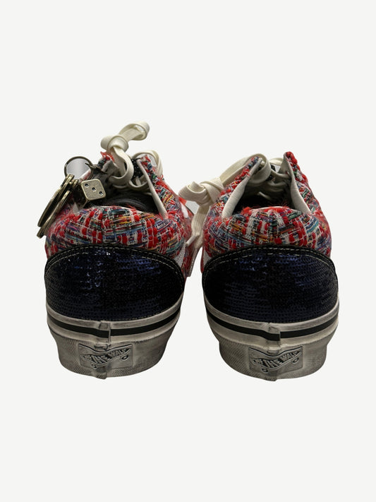 Heel view of Vans Old Skool sneakers showing navy sequin back panels and red tweed collar detail