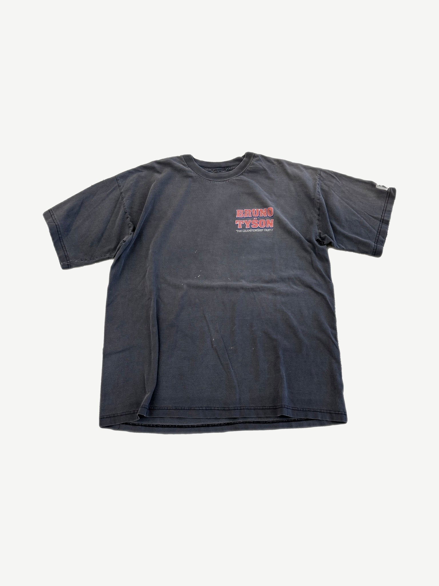 Vintage 1996 Tyson vs Bruno faded black boxing tee with small red Championship Part 1 logo on chest