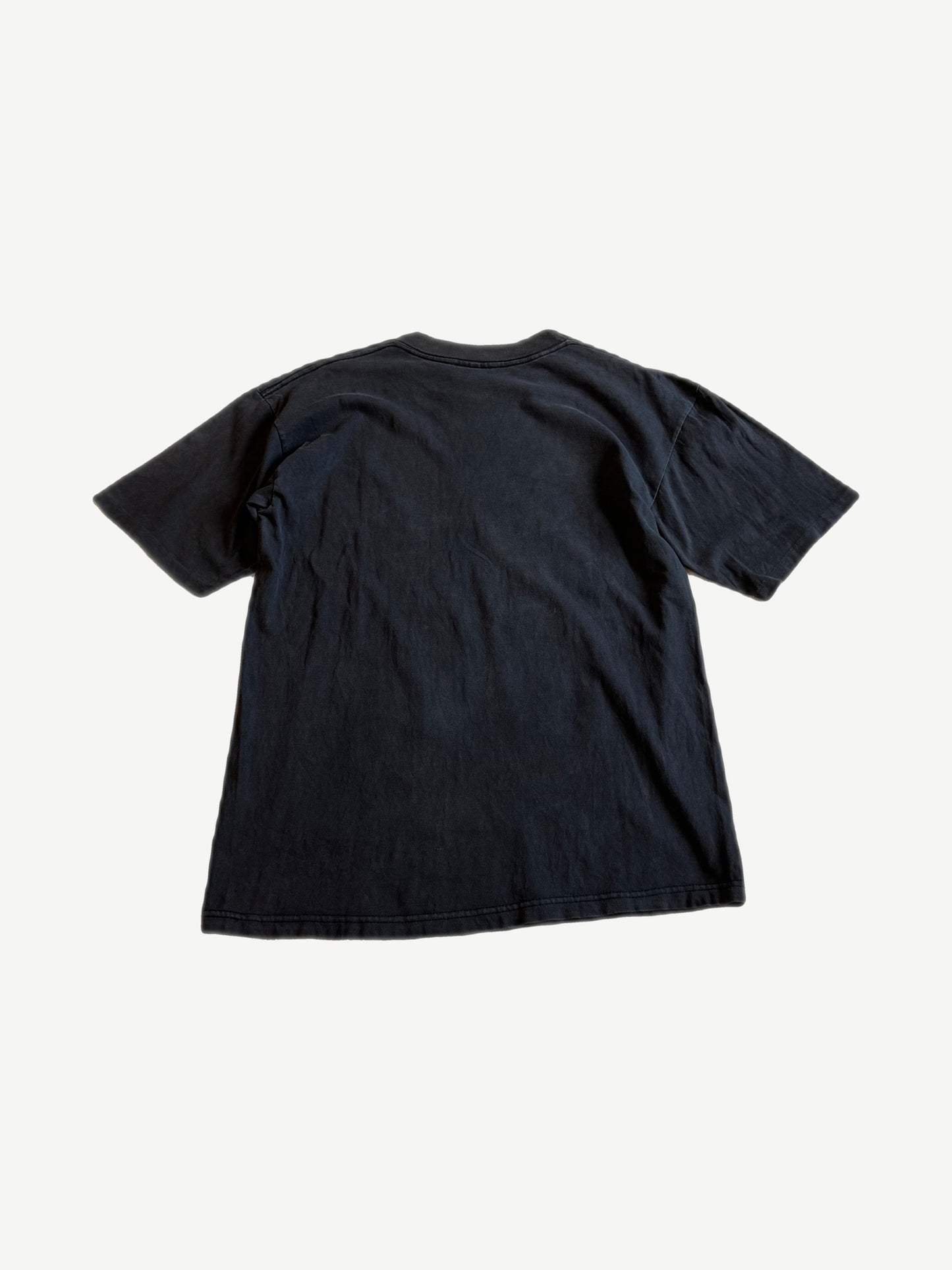 Back of vintage MTV Beavis and Butt-Head black tee with blank faded cotton body, no print