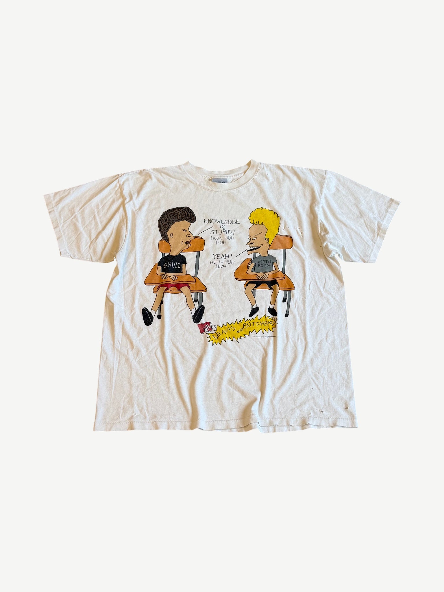 Vintage MTV Beavis and Butthead tee in cream with Knowledge Is Stupid classroom desk cartoon graphic.