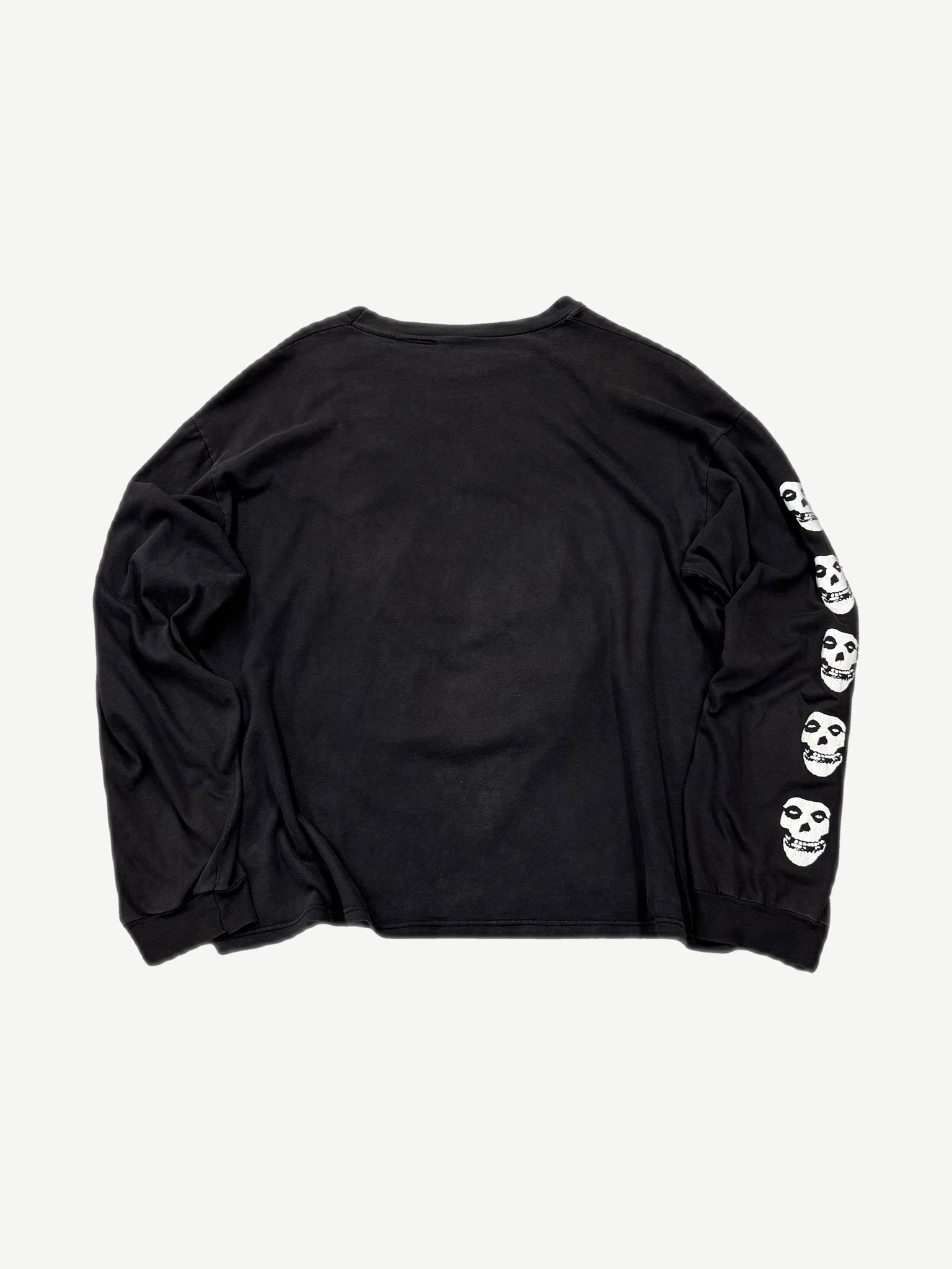 Vintage Misfits black longsleeve back view with white Crimson Ghost skull repeats down right sleeve