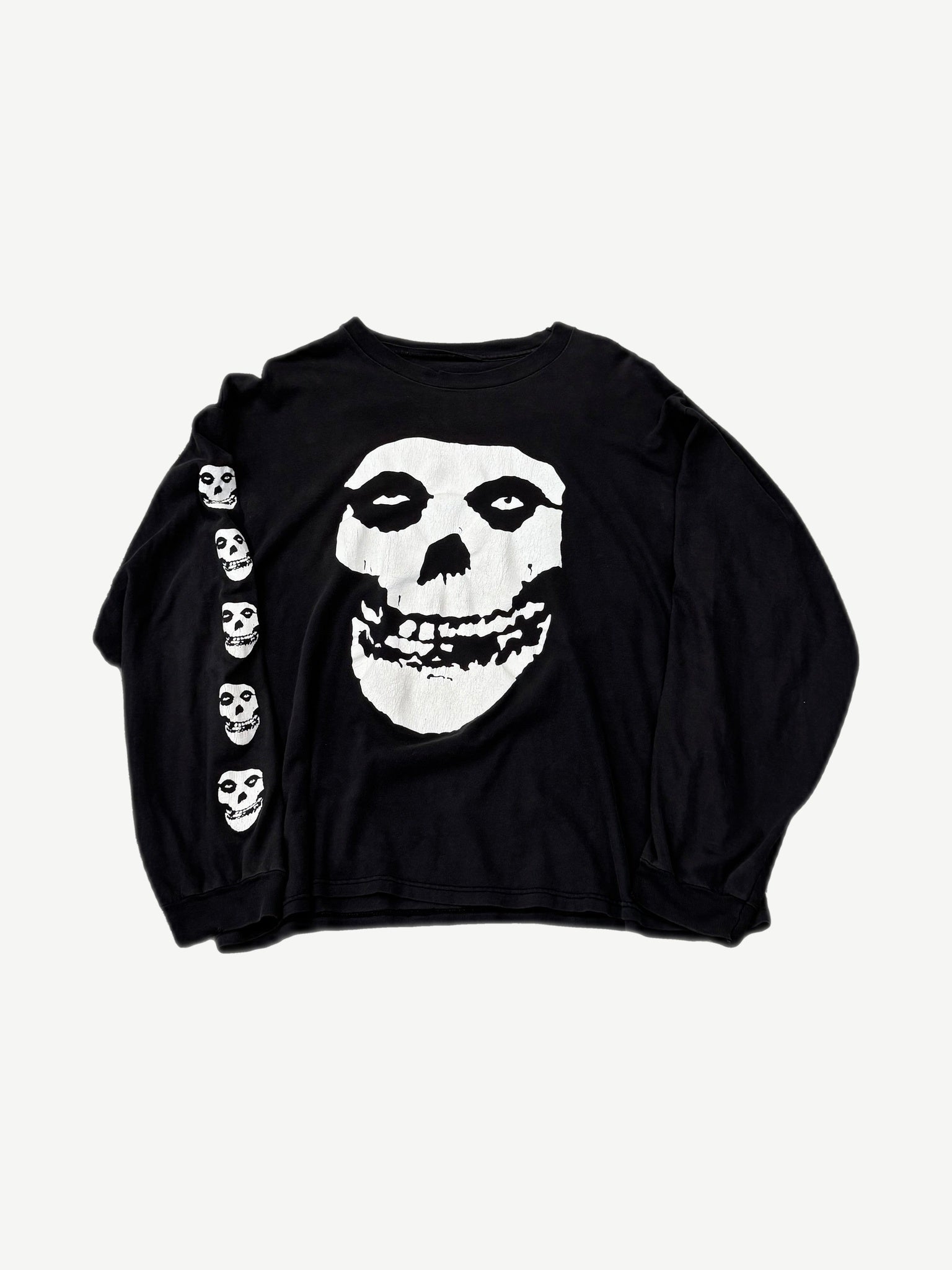 Vintage Misfits black longsleeve front with large white Crimson Ghost skull graphic and skulls down left sleeve