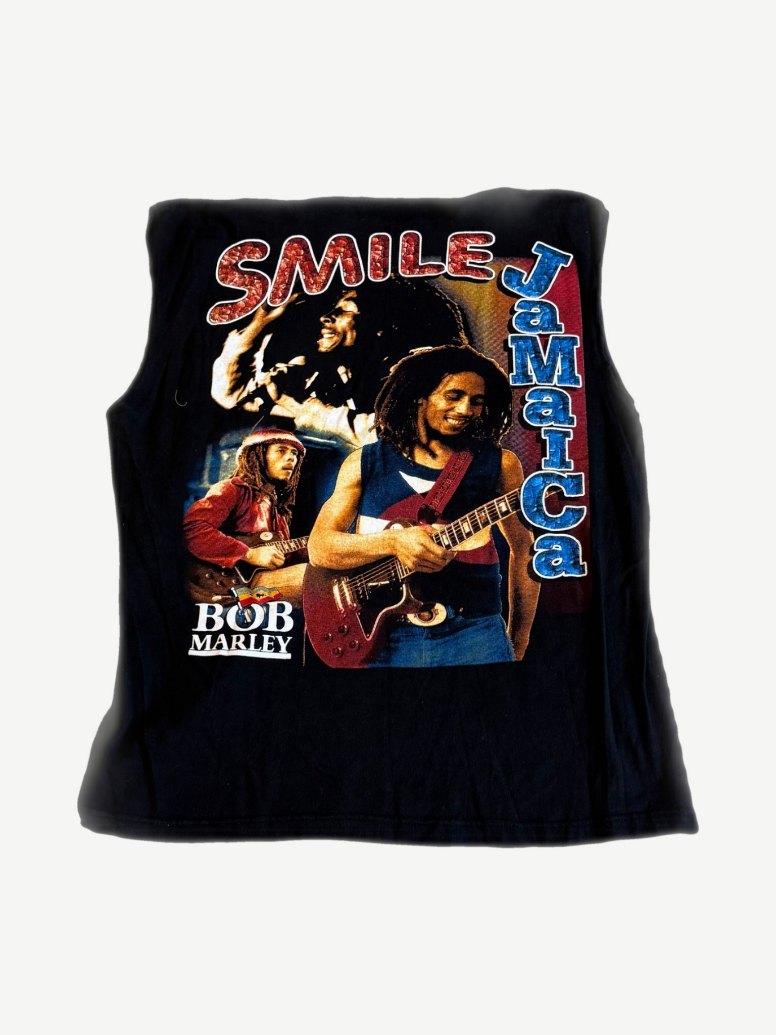 Vintage Bob Marley cutoff back with Smile Jamaica blue text and guitar performance photo collage graphic