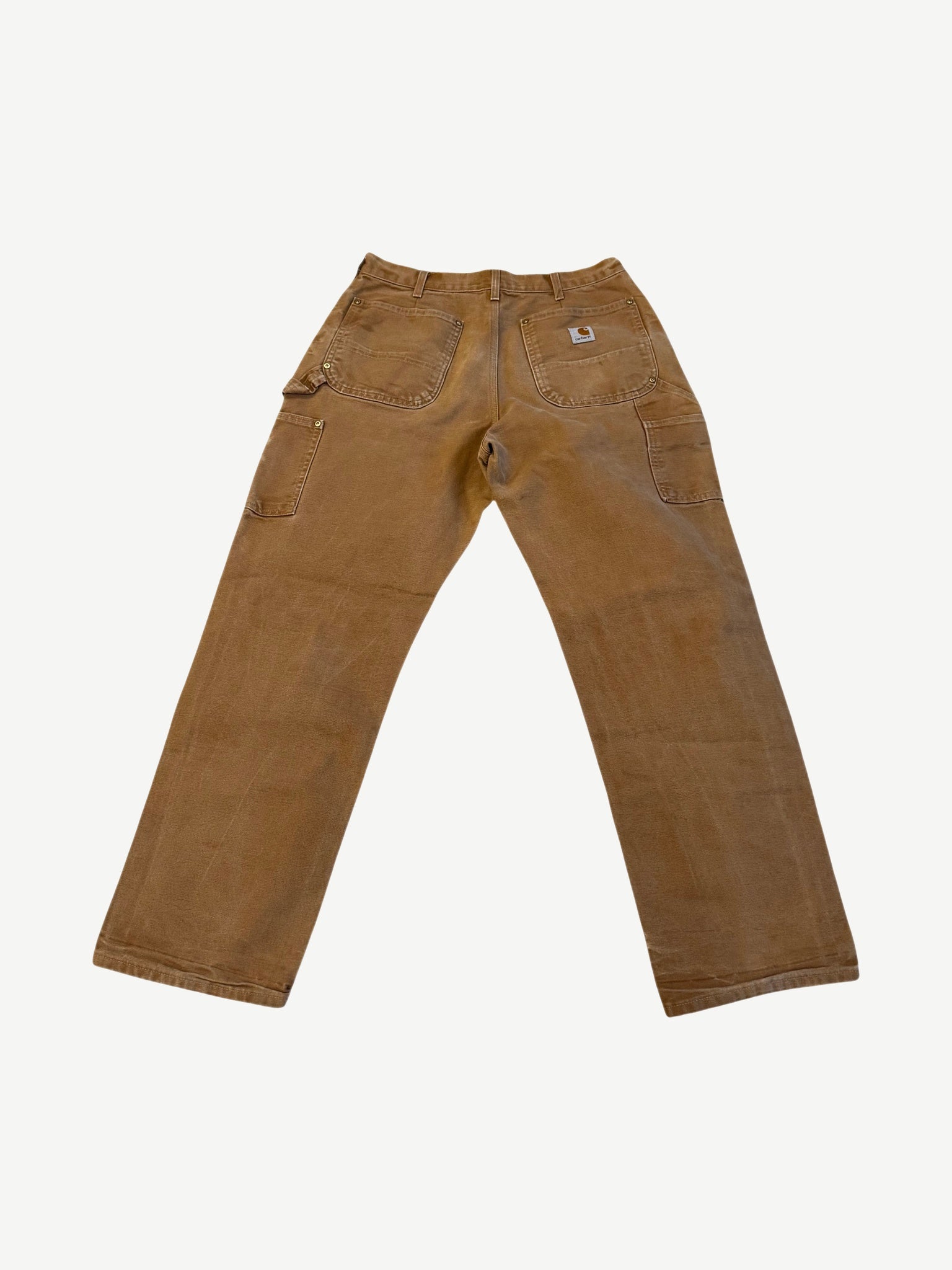 Vintage Carhartt brown carpenter pants back view with patch pockets, hammer loop and Carhartt label
