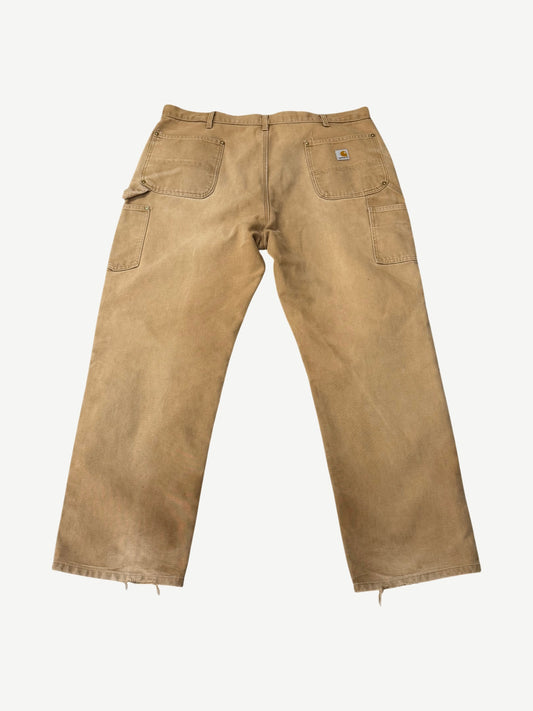 Vintage Carhartt tan carpenter pants back view showing utility pockets, hammer loop and Carhartt label