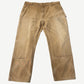 Vintage Carhartt tan double knee carpenter pants front view with faded duck canvas and reinforced knees