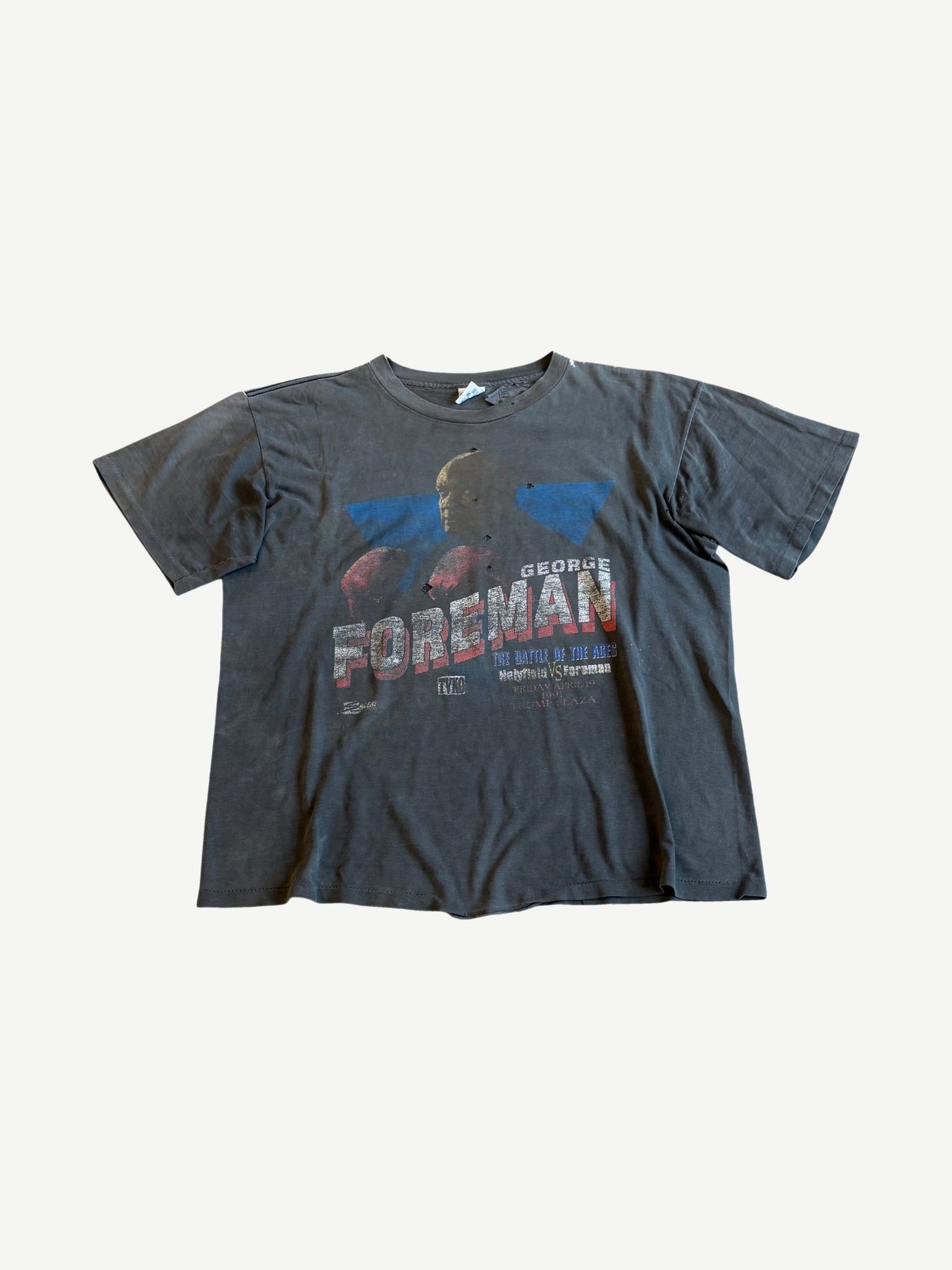 Vintage George Foreman boxing tee in faded black with Battle of the Ages Holyfield vs Foreman fight print