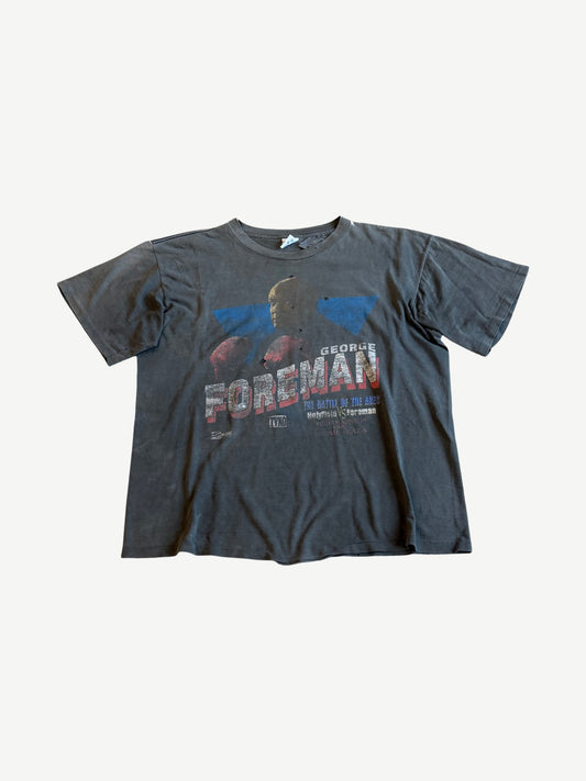 Vintage George Foreman boxing tee in faded black with Battle of the Ages Holyfield vs Foreman fight print