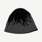 Reverse side of vintage Harley-Davidson beanie showing gray base with black flame knit pattern detail