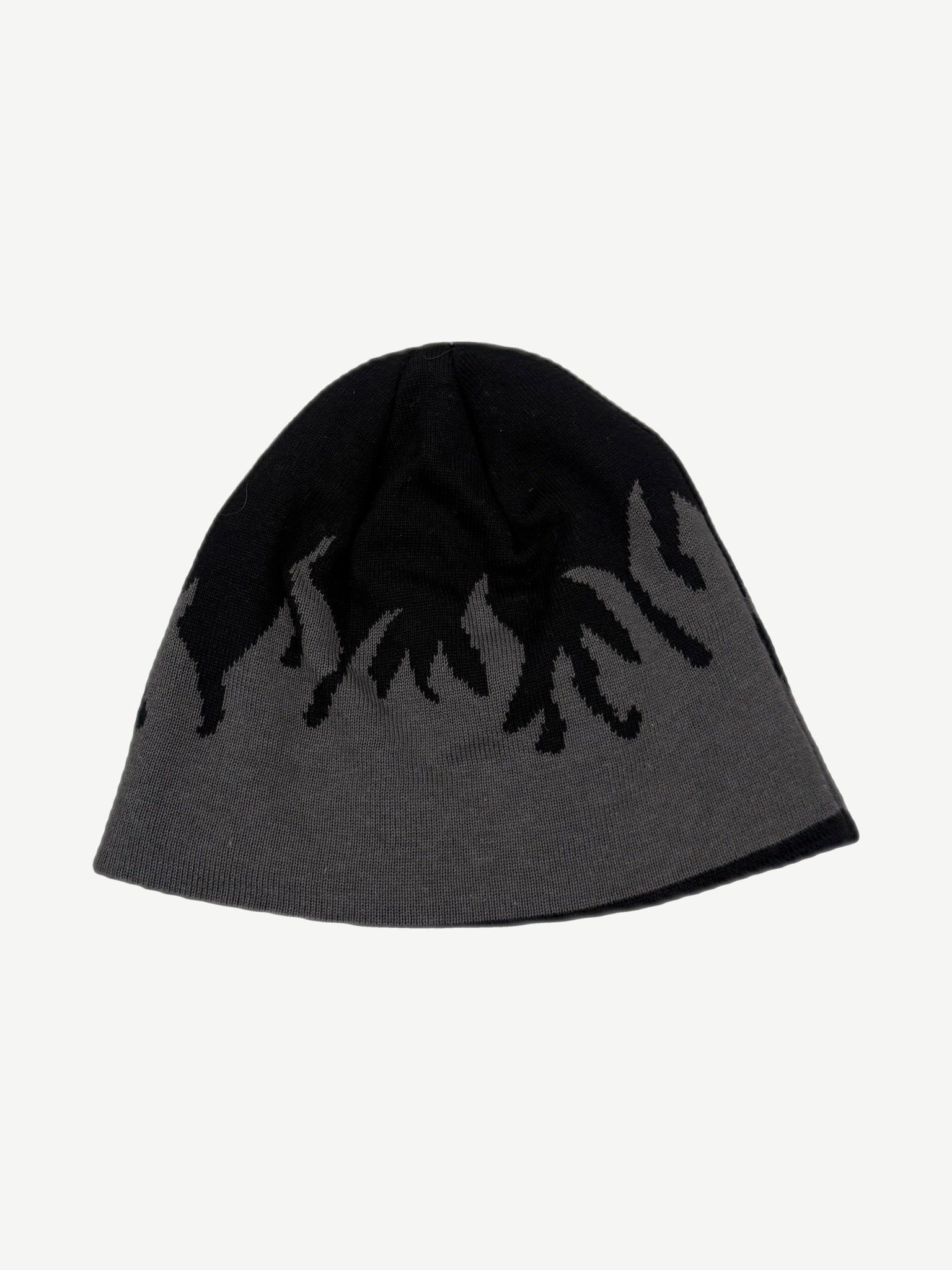 Reverse side of vintage Harley-Davidson beanie showing gray base with black flame knit pattern detail