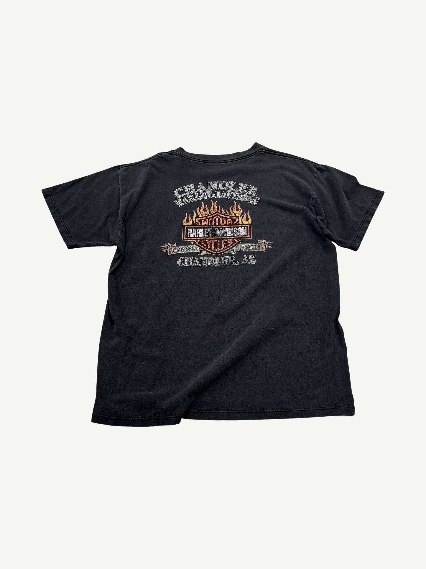 Back of vintage Harley Davidson tee with Chandler AZ flaming Motor Cycles dealership graphic in orange