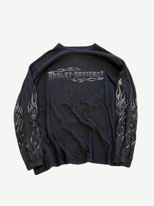 Vintage Harley Davidson black longsleeve front with silver flame sleeve graphics and faded crewneck collar.