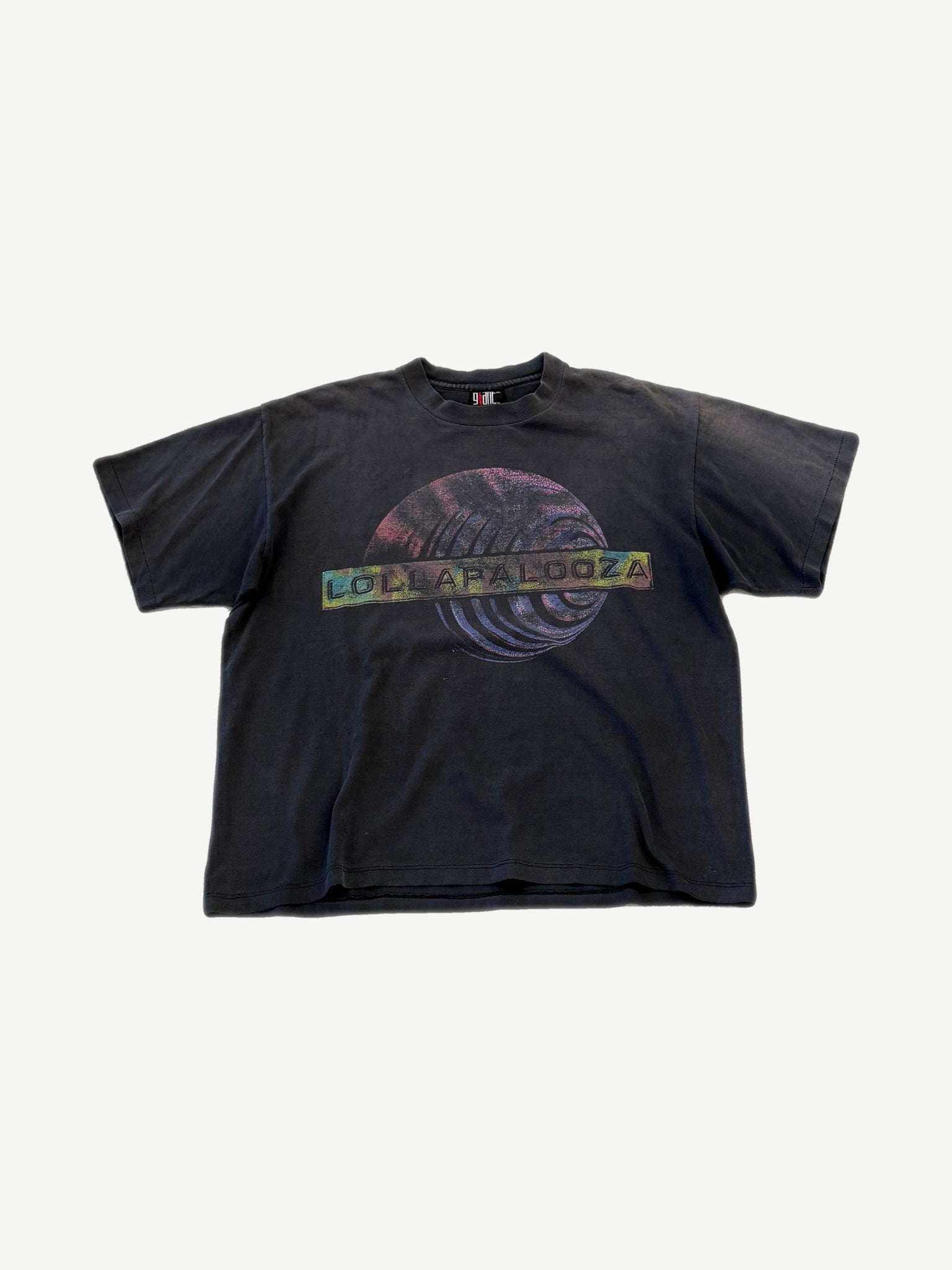Vintage Lollapalooza 1996 faded black concert tee with cosmic sphere graphic and tour name banner.