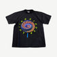 Vintage Lollapalooza 1991 festival tee in faded black with neon lollipop spiral graphic and circular text print.