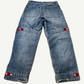 Vintage Girbaud light wash baggy jeans back view with red signature ribbon strap detailing at cuffs