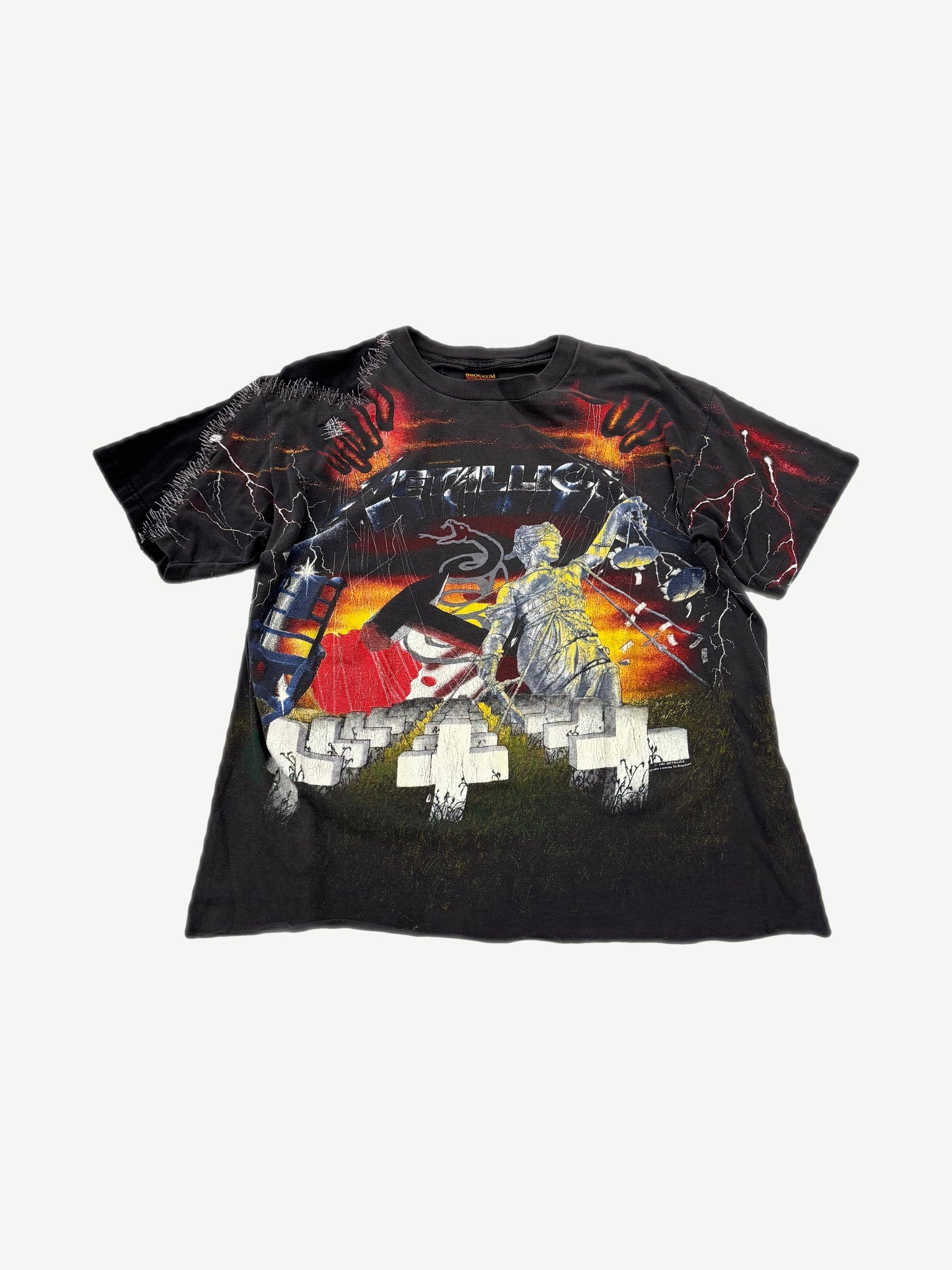 Vintage Metallica all over print tee front with Justice statue, lightning bolts and white crosses graphic