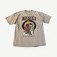 Vintage Metallica Burn Your Fingers tour tee in tan with flaming target graphic and red Metallica logo.