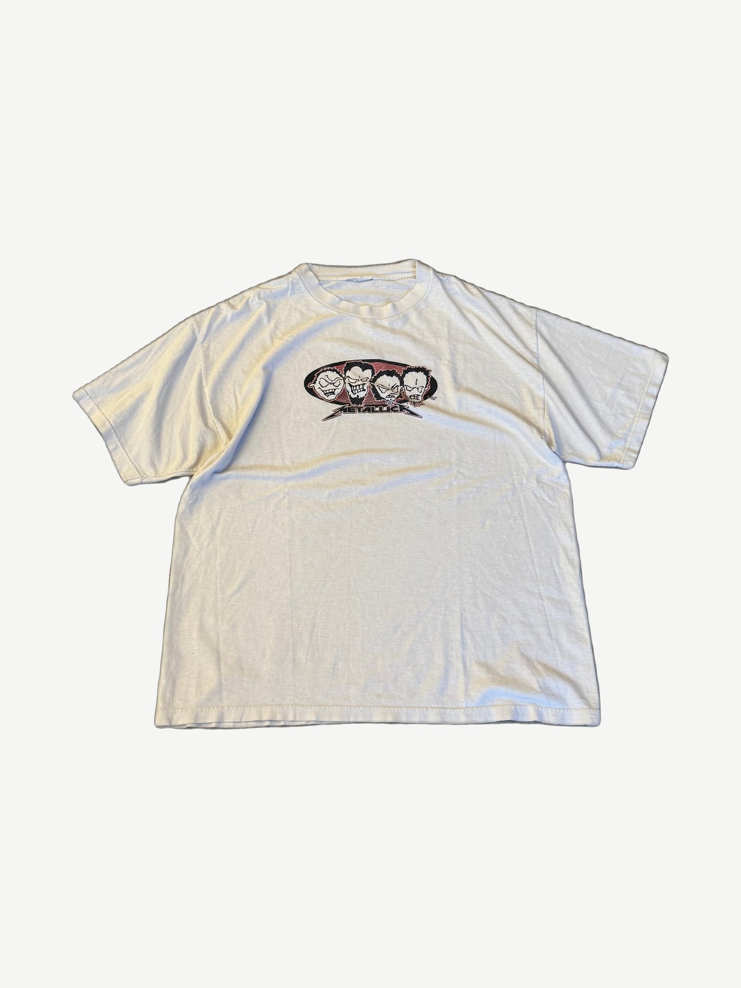 Vintage Metallica M2K tour tee in faded cream with cartoon band caricature center chest print and logo.