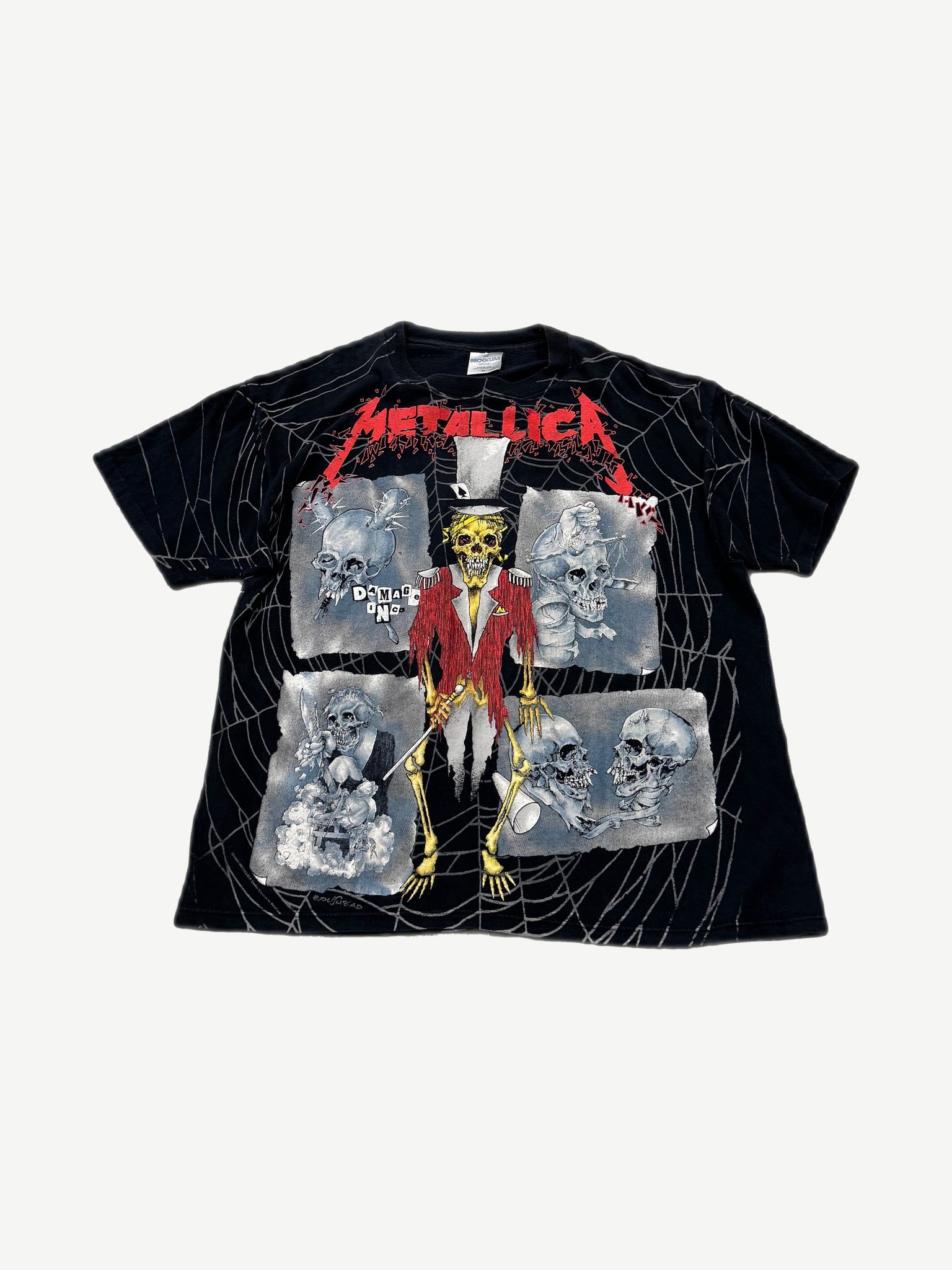 Vintage Metallica Ringmaster all over print tee with skeleton ringmaster, skull panels and spider web graphics.