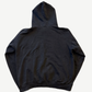 Back of vintage Misfits faded black hoodie showing blank distressed cotton fleece and hood drape